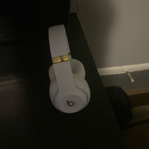 White and gold beats headphones